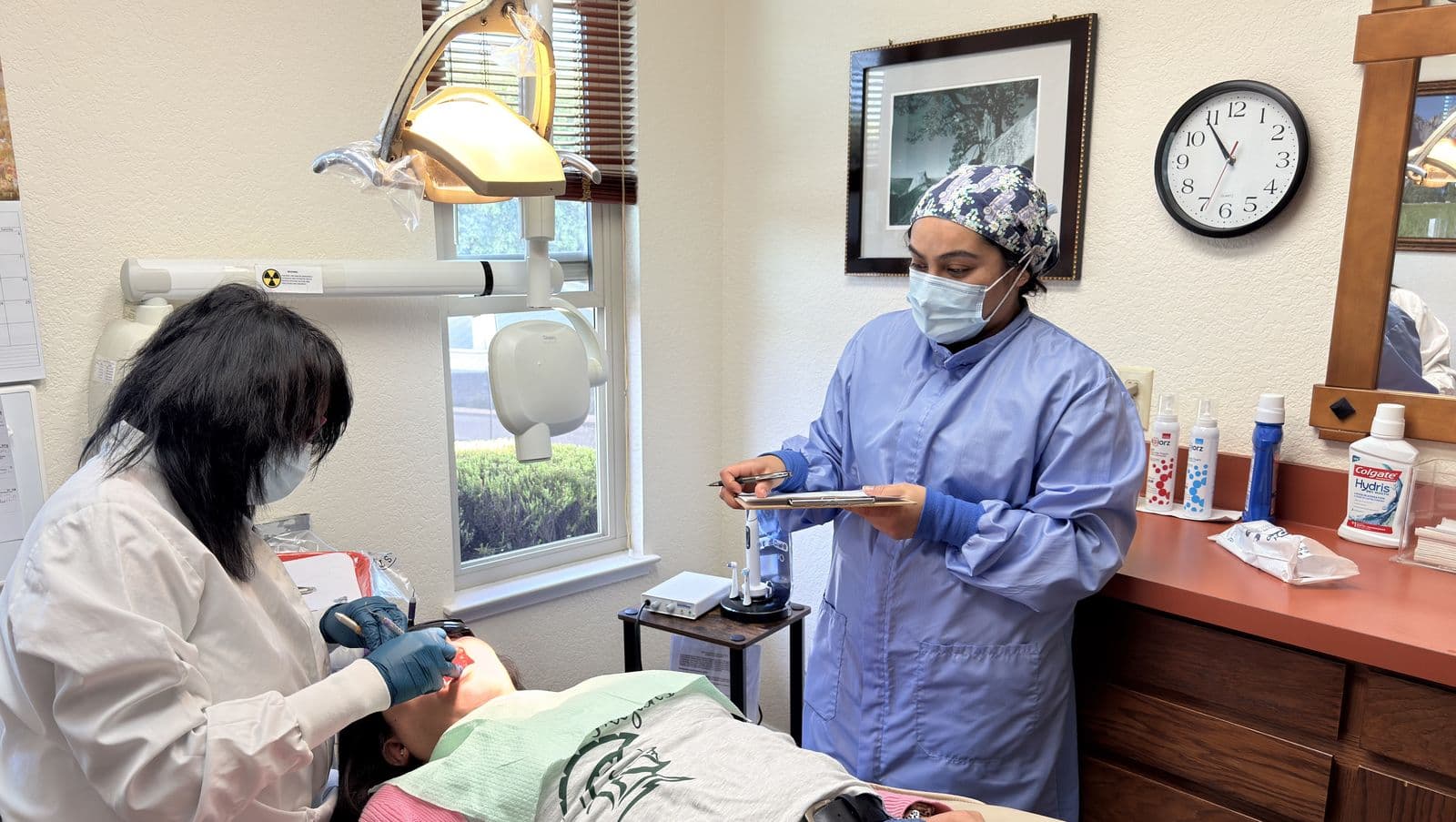 Dental team collaborating during a procedure